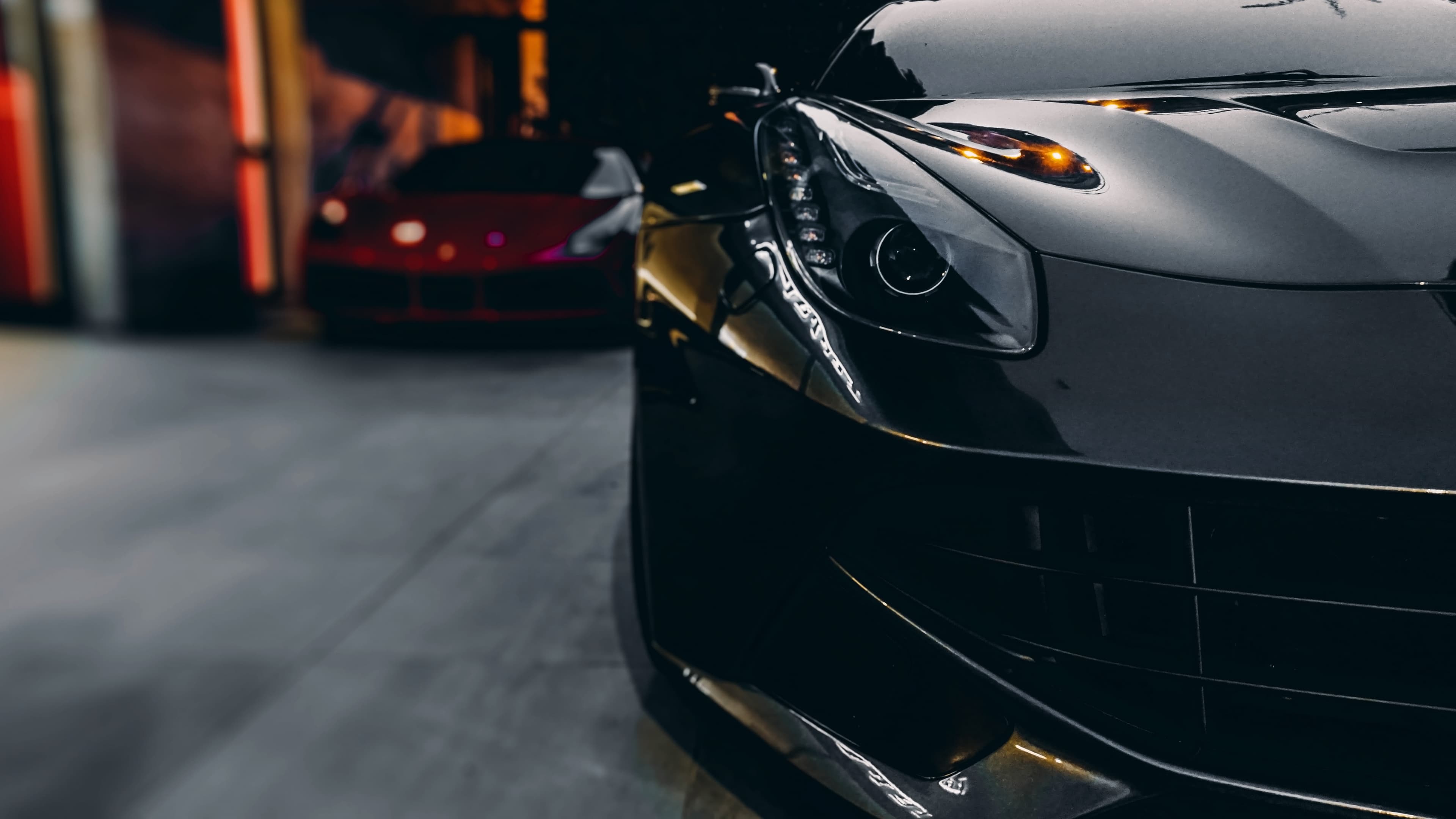 Sports cars parked inside a garage