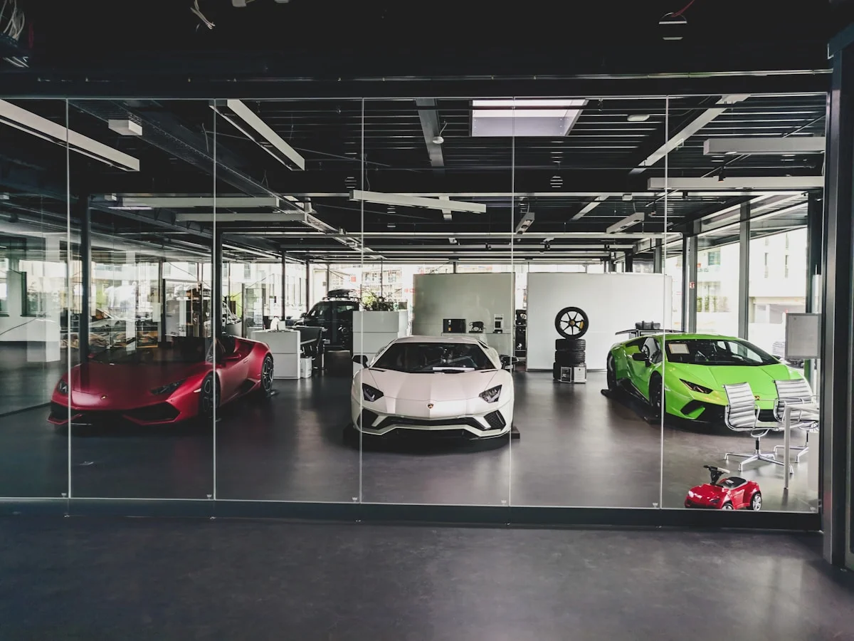 Luxury car showroom featuring Lamborghini exotic vehicles in climate-controlled environment